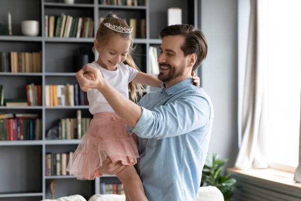 istock Happy young father dancing with little daughter. 1320170288