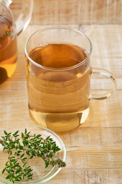 istock Glass cup of thyme tea and fresh thyme 1320170666