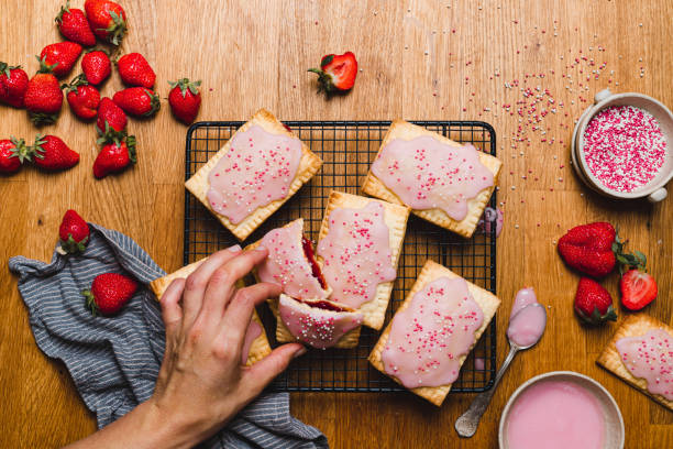 istock Woman preparing jam filled pastry tarts 1320170769