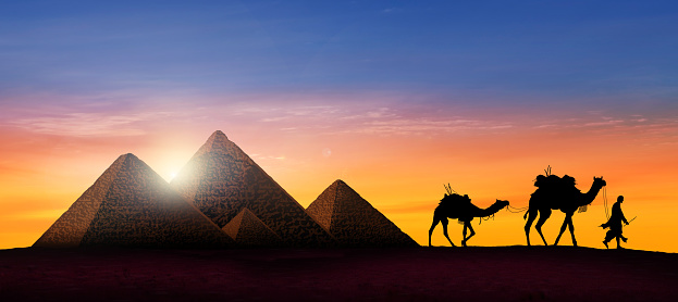 Camel caravan in desert at beautiful sunset - Image manipulation
