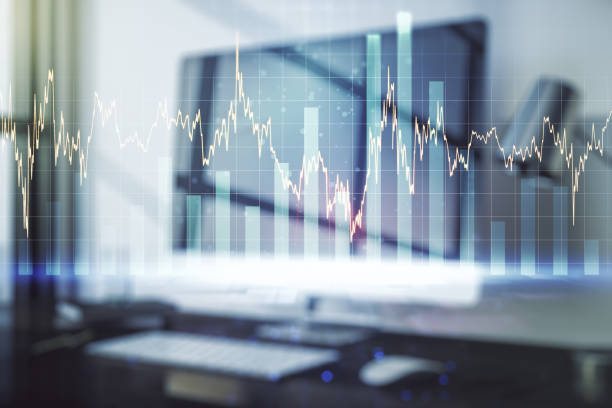 istock Abstract creative financial graph on modern laptop background, financial and trading concept. Multiexposure 1320171580