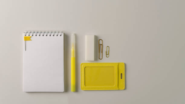istock White notebook and stationery yellow on a gray background. Copying space, flat layout 1320173718