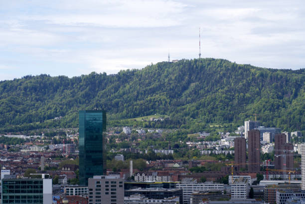 istock Zurich skyline at springtime with mountains in the background. 1320176005