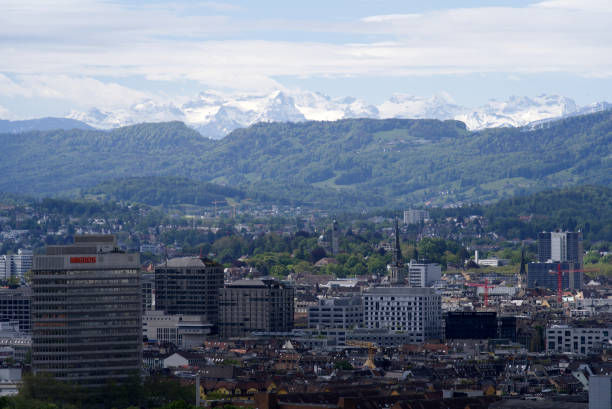 istock Zurich skyline at springtime with mountains in the background. 1320176038