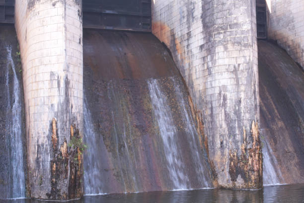 istock Close up view of a dam with white water stream flowing though it 1320179207