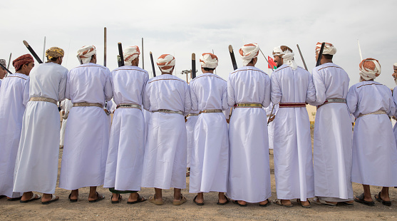 Arabic culture display - traditional cloth - Middle Eastern Culture - Emirati Men - tourist attraction activities\n- Abu Dhabi, UAE - December 23, 2019