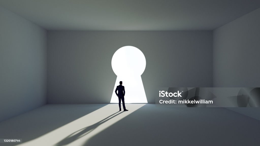 Man stands before a key decision and faces a wall with giant key hole Digitally generated image of man in front of a gigant key hole in a wall. He looks at the hole and has to chose the way to success.  Concept of chosing the right path. Keyhole Stock Photo