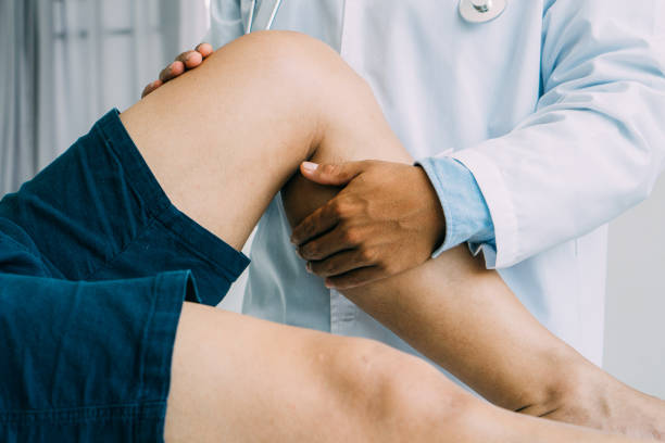 istock Physiotherapist treating with patient about elbow pain problems.Physical therapy concept 1320183028