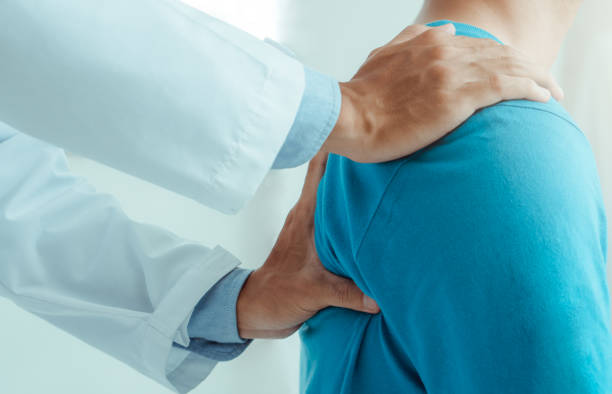 istock Physiotherapist working with patient in hospital.Physical therapy concept 1320184031