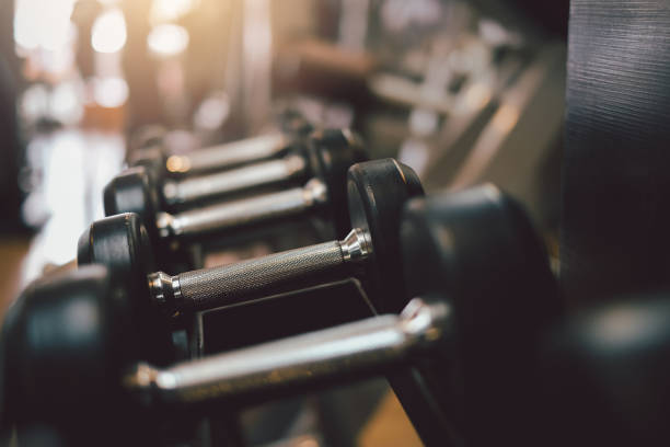 istock Exercise equipment dumbbell in the gym. 1320185323