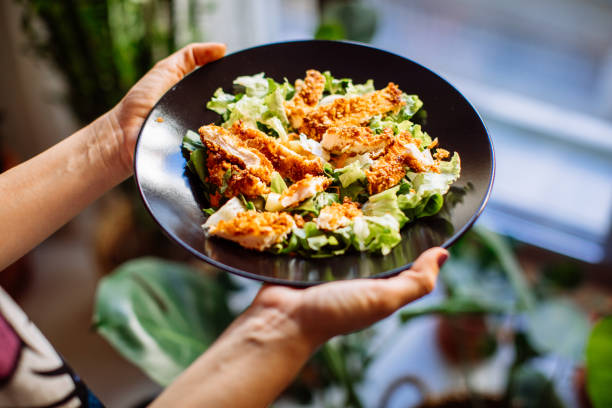 istock Holding a bowl of chicken salad 1320187401