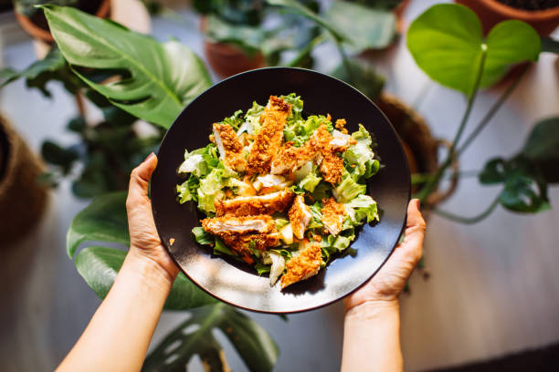 istock Holding a bowl of chicken salad 1320187533