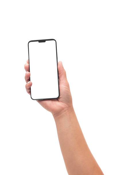 Woman's hand holding straight up a smartphone Close up view of a female hand holding straight up a smartphone with blank screen isolated on white background. Copy space on smartphone screen and in background iphone hand stock pictures, royalty-free photos & images