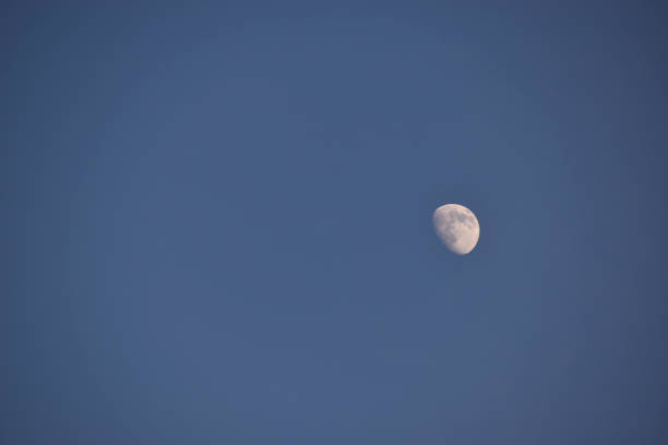 istock White moon in a blue sky in summer 1320188908