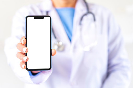 Female doctor showing blank smartphone screen