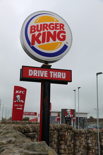 Loanhead, Scotland - 25 May 2021 Burger King and KFC fast food restaurants drive thru signs on a roadside near Edinburgh