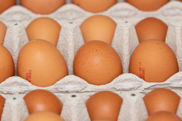 istock Brown and organic chicken egg tray on the table. 1320190571