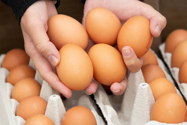 istock Brown and organic chicken egg tray on the table. 1320190723