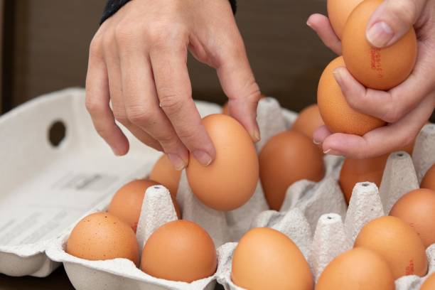 istock Brown and organic chicken egg tray on the table. 1320190729