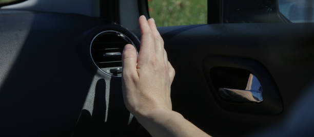 istock Hand checking the air conditioner in the car 1320194538
