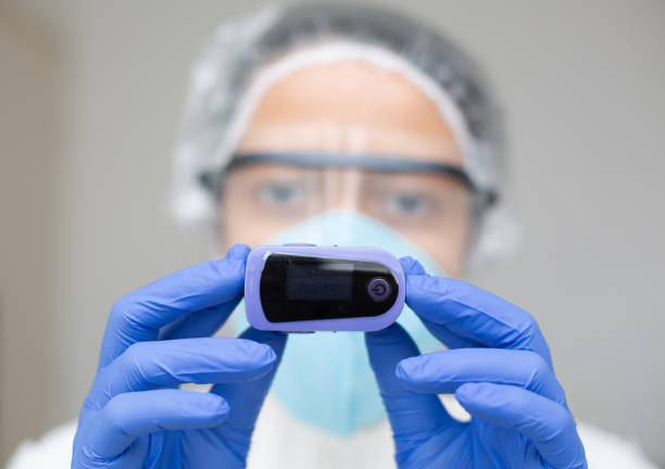 istock Oximeter monitoring saturation and oxygen for COVID 19. 1320194784