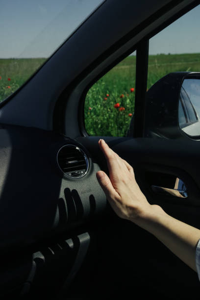 istock Hand checking the air conditioner in the car 1320194968