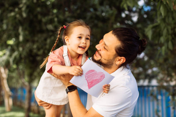 istock Father and his child playing together 1320195070