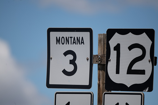 Highway sign on country highway in central Montana in western USA.