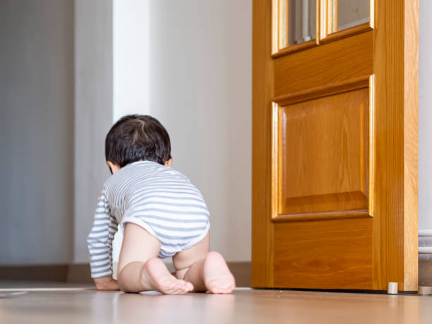 istock Baby boy crawling at home and learning how to crawl. 1320198820
