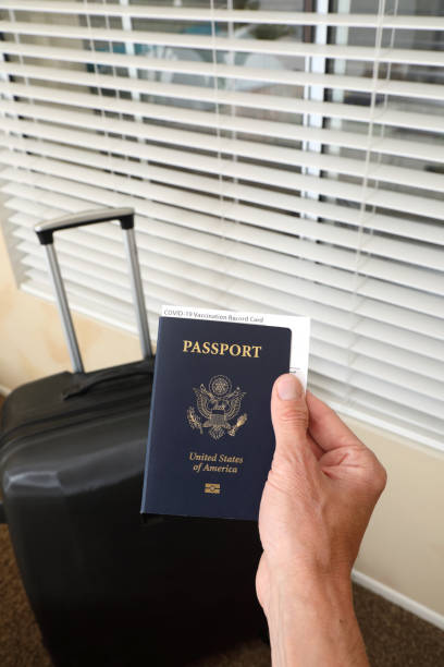 istock Vaccination Report Card in Passport 1320198905