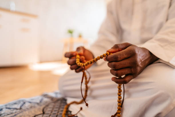 istock Muslim man holding prayer beads while praying 1320199041