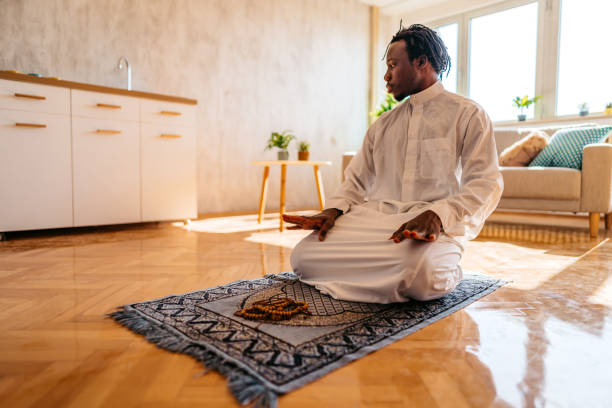 istock Muslim man is praying at home 1320199675