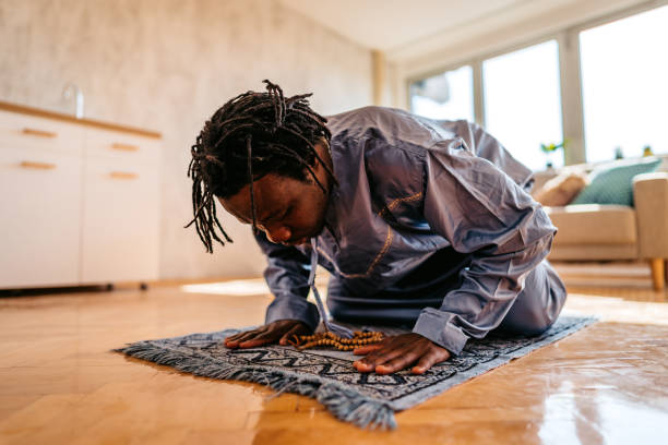 istock Muslim man is praying at home 1320199722