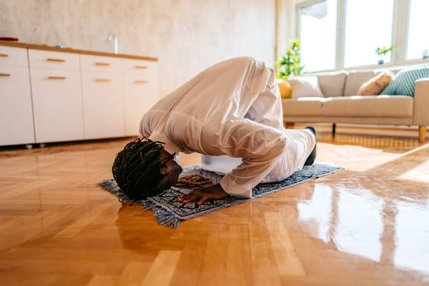 istock Muslim man is praying at home 1320199745
