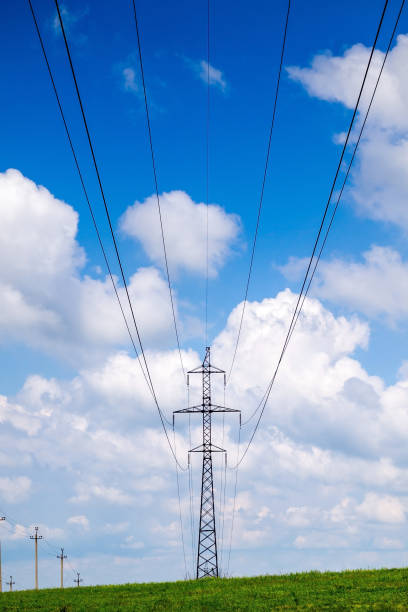 istock High voltage power lines and cloudy blue sky. 1320201649