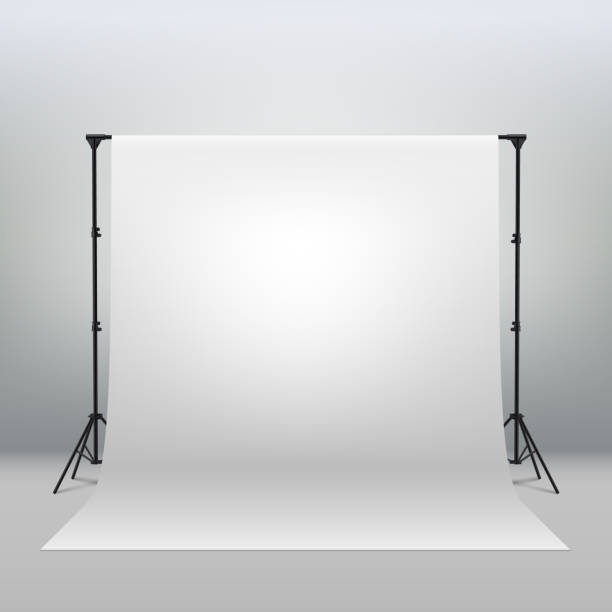 Professional photo studio interior. Photography tripods and racks and paper roll White Backdrop Background for Photography Photo Booth Backdrop for Photoshoot Background Screen Video Recording Parties Curtain. Professional photo studio interior. Photography tripods and racks. photography themes photos stock illustrations