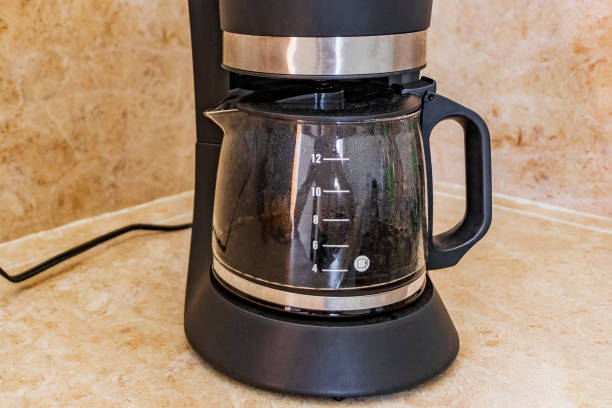 istock Black coffee maker from Mexico on cream background in clean kitchen. 1320203674