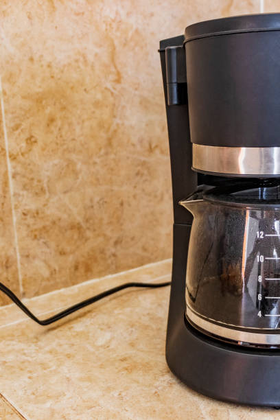 istock Black coffee maker from Mexico on cream background in clean kitchen. 1320204328