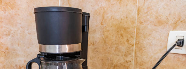 istock Black coffee maker from Mexico on cream background in clean kitchen. 1320204362
