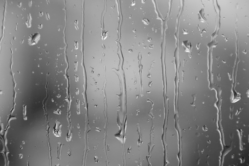 Water drops in a glass surface. Abstract background