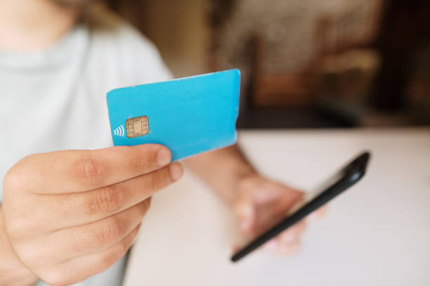 istock Shopping online with a smart phone and a credit card 1320206870