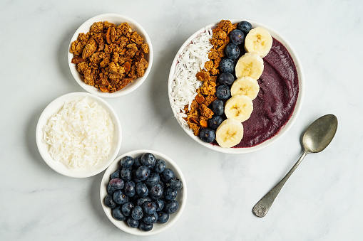 Blueberry smoothie bowl with fresh fruit and granola