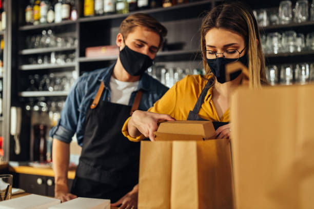 istock People packing food for delivery 1320208064