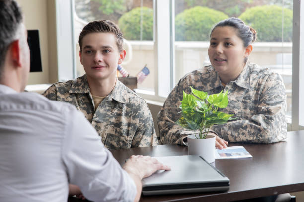 istock Two young adults soldiers listening during group therapy session 1320208604