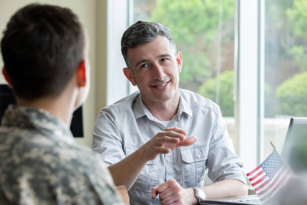istock Mature businessman meets with veterans to discuss loan 1320208607