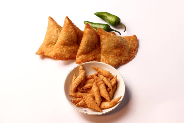 Isolated Potato Samosa Snacks on White Background. Indian Ramadan Food, Pakistani Iftar Meal.