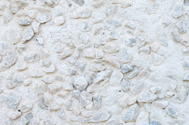 istock White wall with white and gray stones, texture, background 1320211918