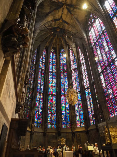 Mixed race woman traveler with backpack standing at the entrance to the Leipzig Thomas Church