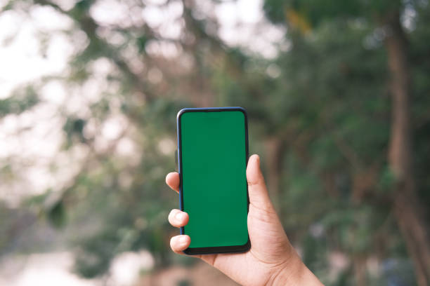 istock rear view of young man using smart phone at outdoor 1320214027