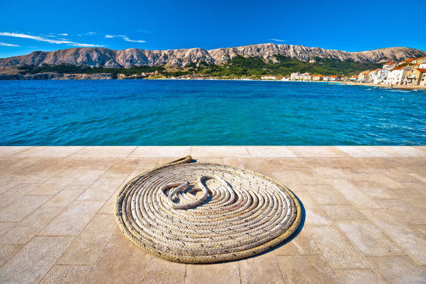 Boat rope on Stone pier by the sea, Island of Krk, Croatia